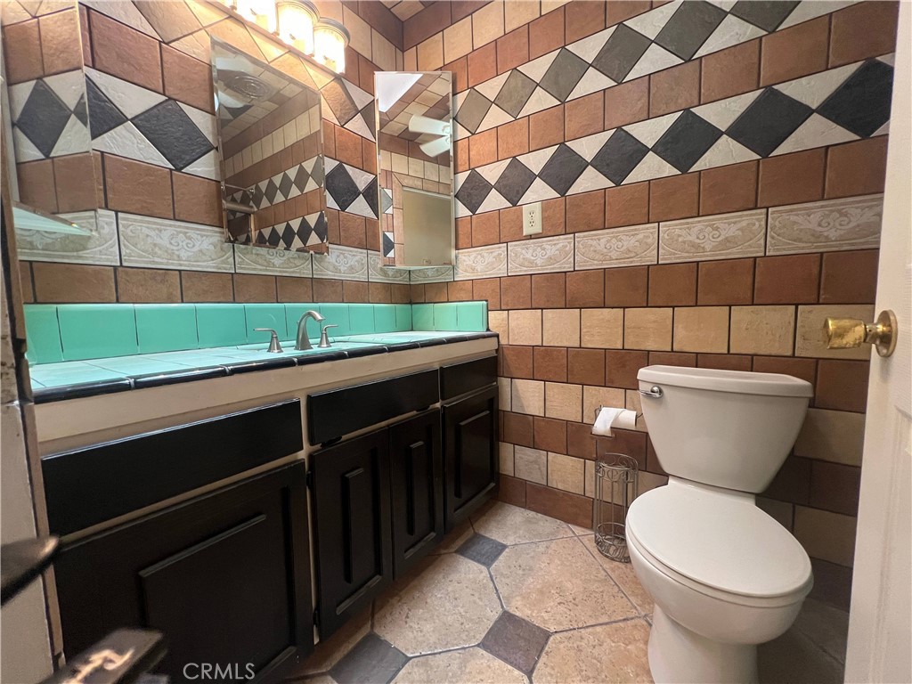 15558 Del Rey Drive Victorville, CA 92395 - Photo 17 of 30 a bathroom with a sink and a toilet