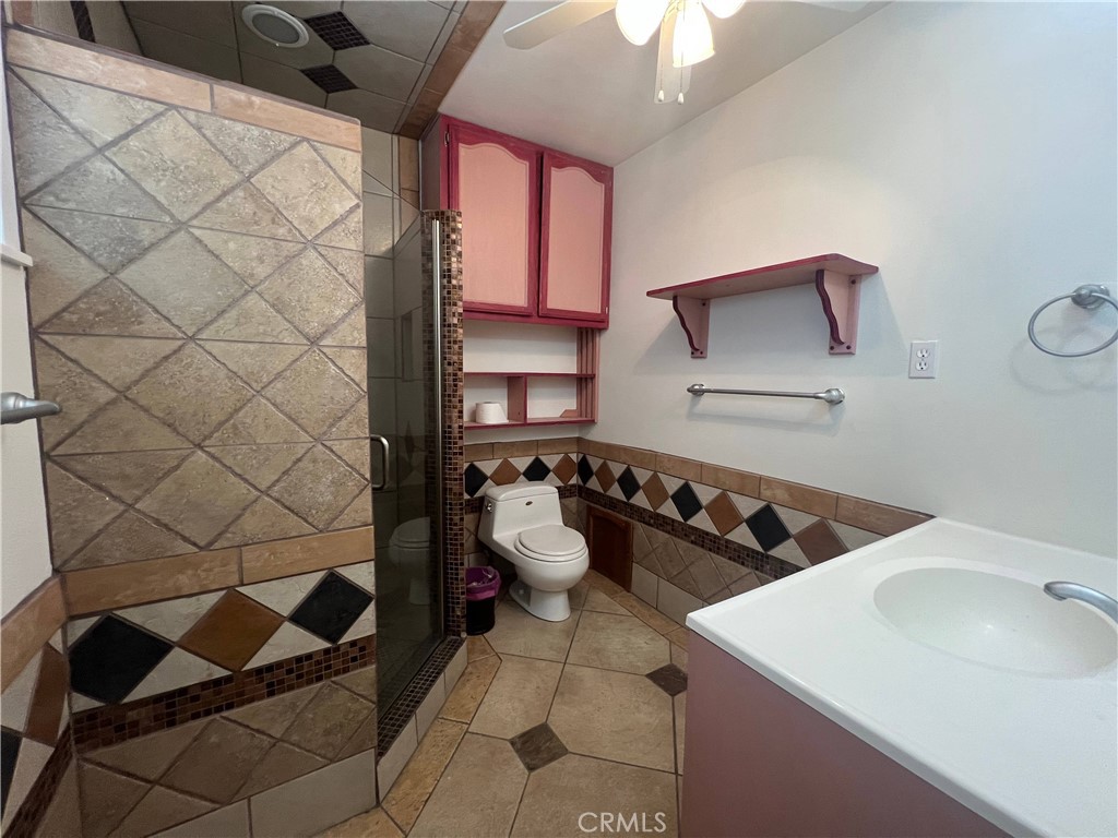 15558 Del Rey Drive Victorville, CA 92395 - Photo 19 of 32 a kitchen with a sink and a stove with wooden floor