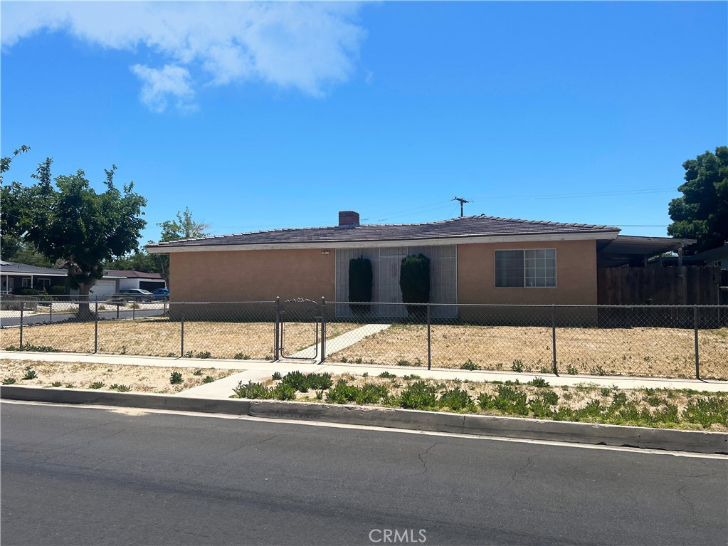 15558 Del Rey Drive Victorville, CA 92395 - Photo 2 of 30 a front view of a house with a yard and garage