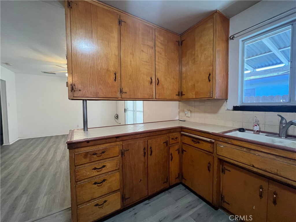 15558 Del Rey Drive Victorville, CA 92395 - Photo 8 of 30 a kitchen with cabinets appliances and a sink