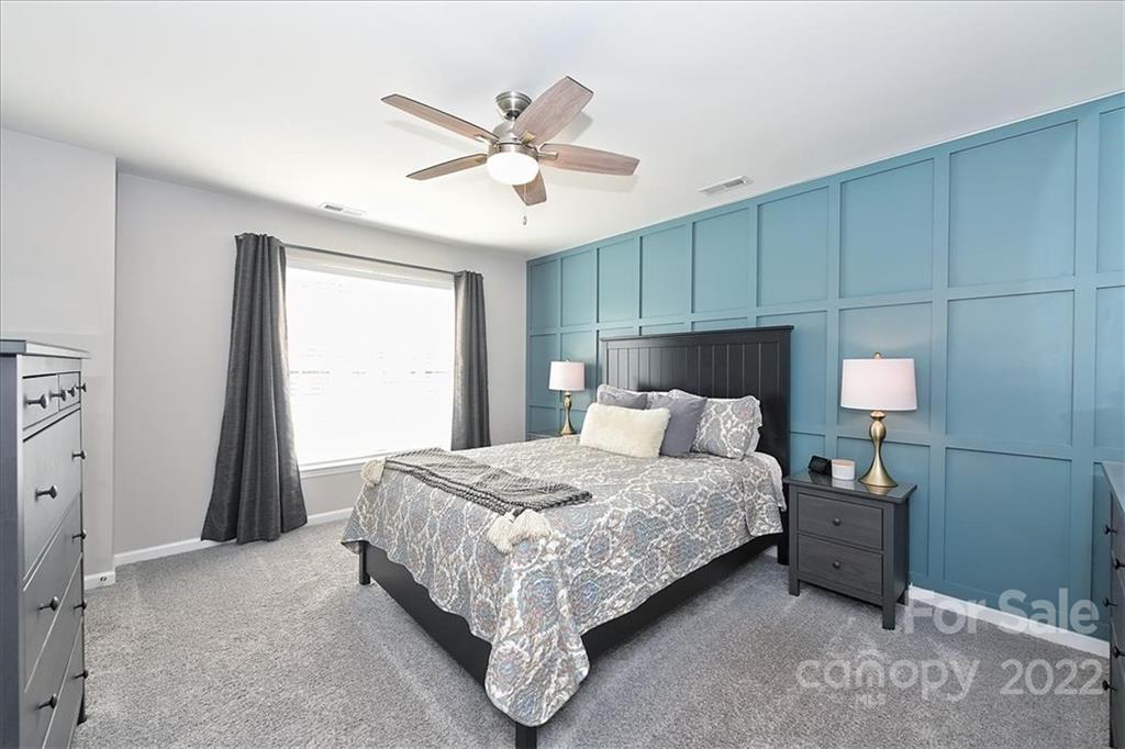 7671 Black Hawk Lane Tega Cay, SC 29708 - Photo 23 of 45 a bedroom with a bed and closet
