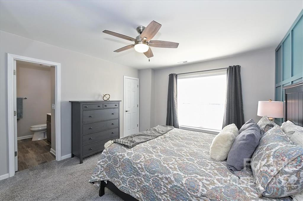 7671 Black Hawk Lane Tega Cay, SC 29708 - Photo 24 of 45 a bedroom with a bed and a window