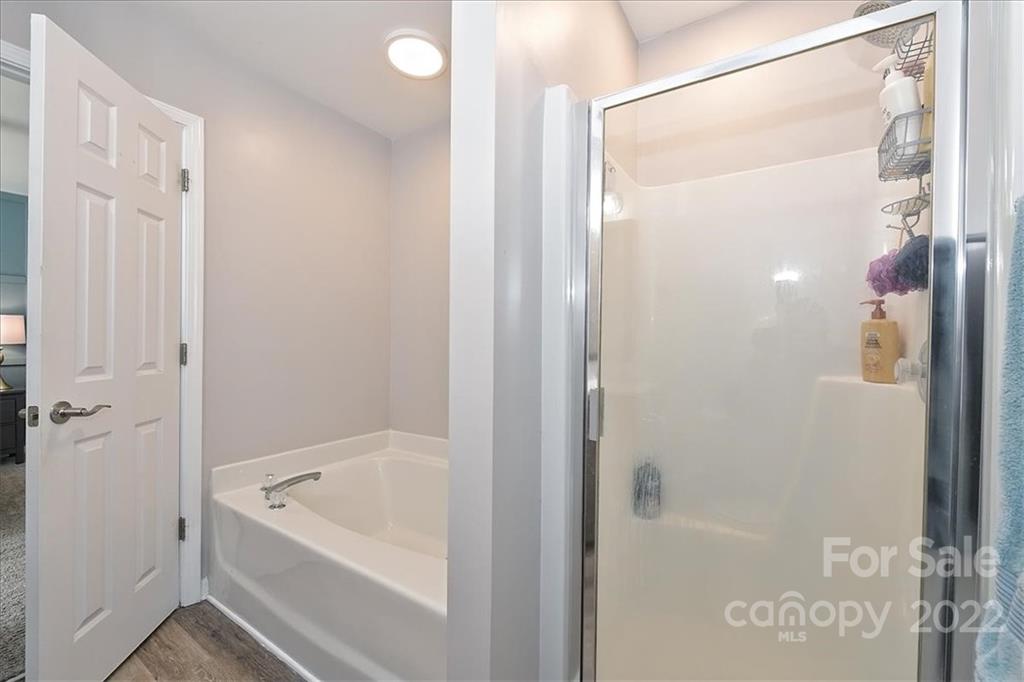 7671 Black Hawk Lane Tega Cay, SC 29708 - Photo 27 of 45 a bathroom with a tub shower and sink