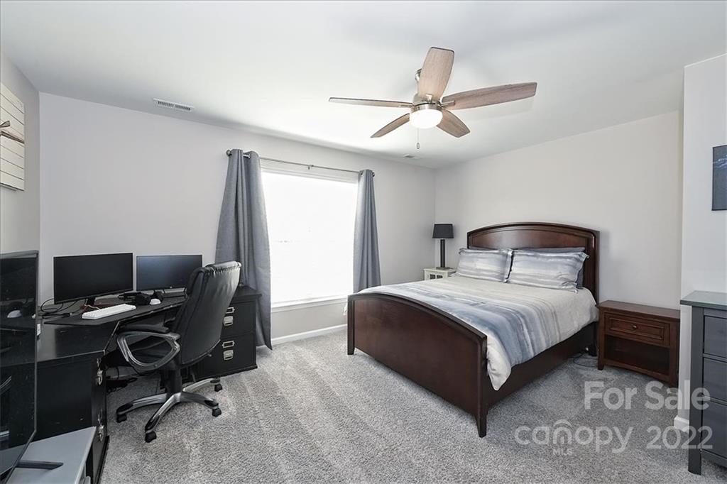 7671 Black Hawk Lane Tega Cay, SC 29708 - Photo 29 of 45 a bedroom with a bed and a window