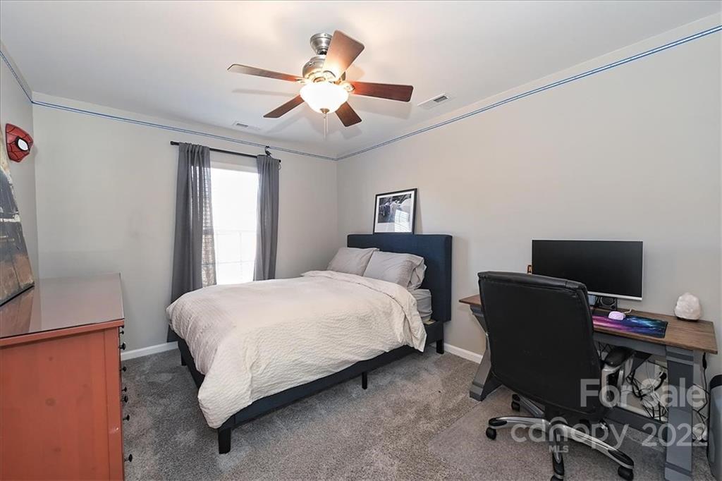 7671 Black Hawk Lane Tega Cay, SC 29708 - Photo 32 of 45 a bedroom with a bed and a desk