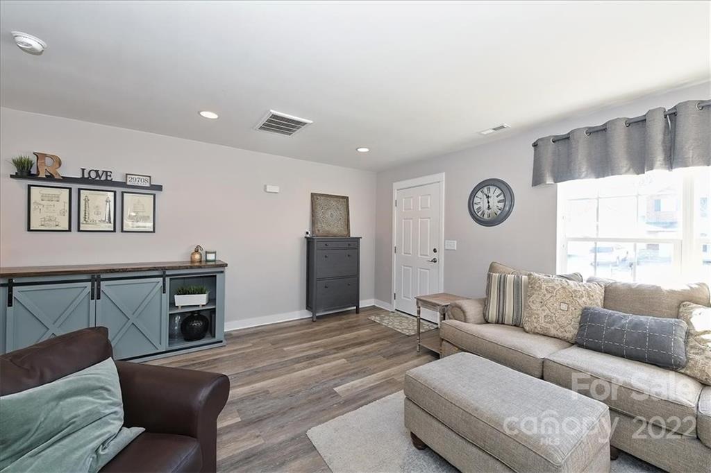 7671 Black Hawk Lane Tega Cay, SC 29708 - Photo 8 of 45 a living room with furniture and a window
