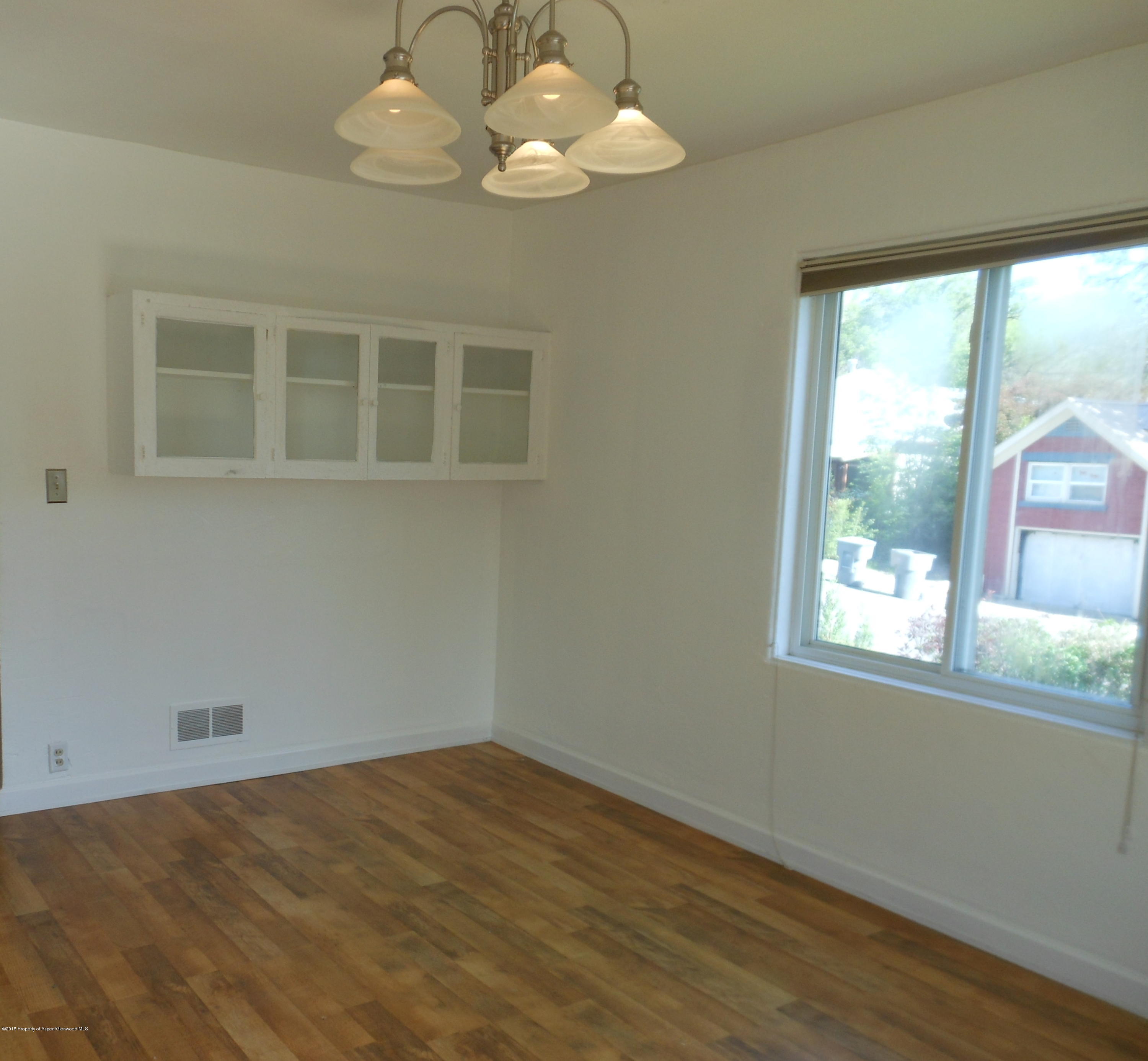 300 East 7th Street Rifle, CO 81650 - Photo 11 of 24 a view of an empty room with a window