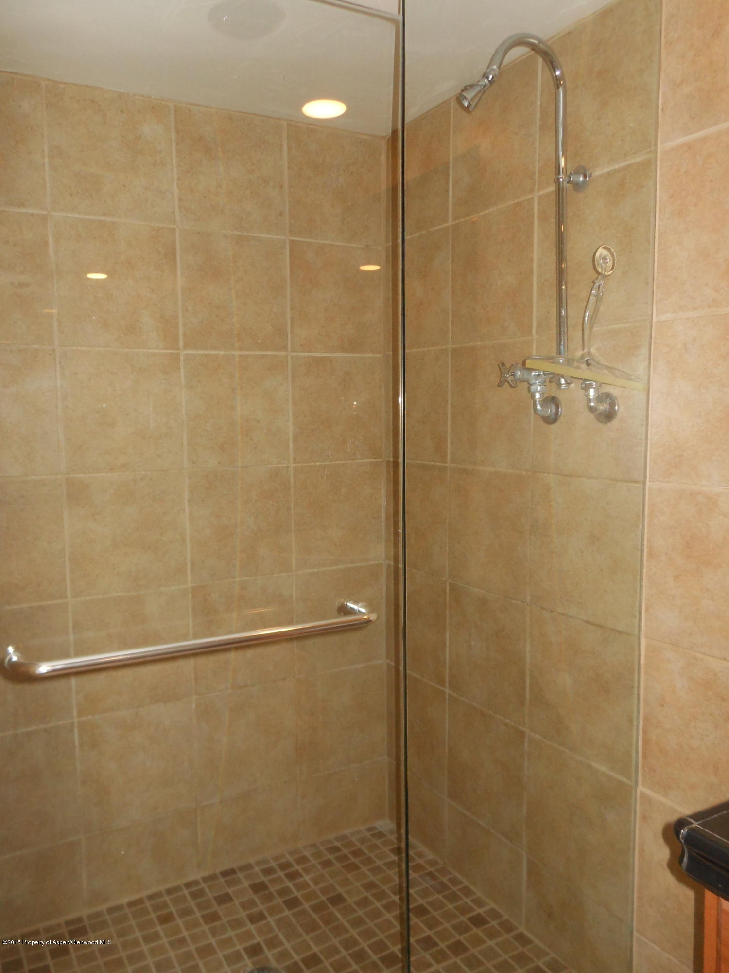 300 East 7th Street Rifle, CO 81650 - Photo 18 of 24 a bathroom with a shower