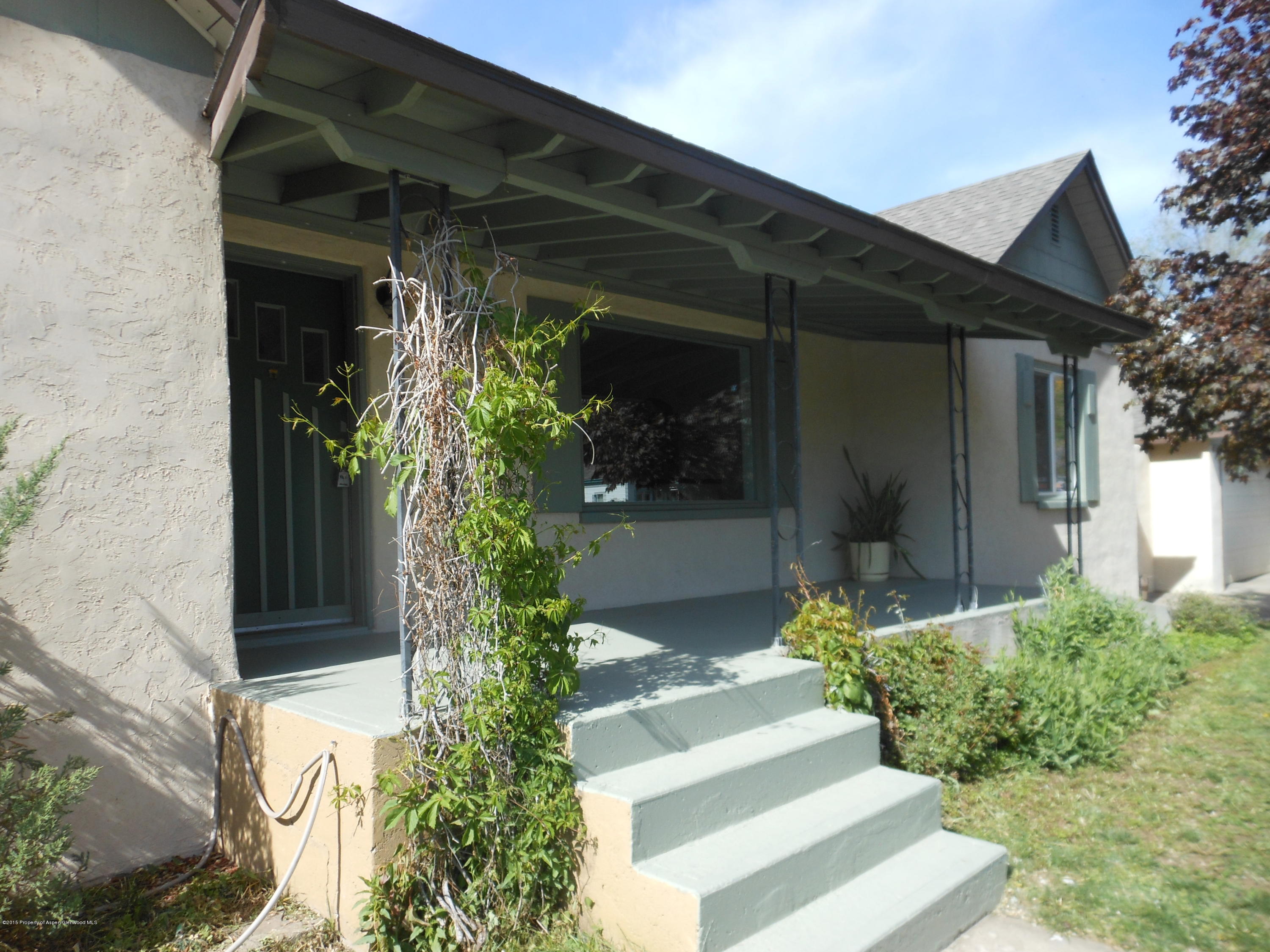 300 East 7th Street Rifle, CO 81650 - Photo 4 of 24 a front view of a house with garden