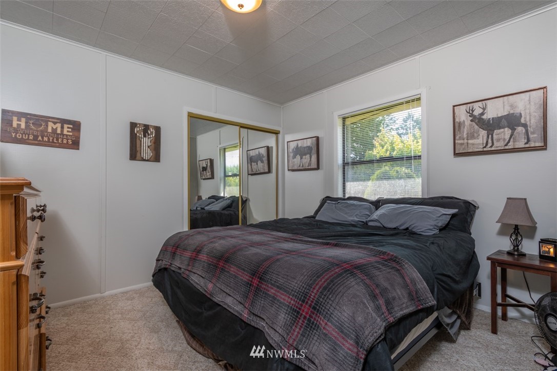 1311 Koontz Road Chehalis, WA 98532 - Photo 12 of 16 a bedroom with a bed and a desk