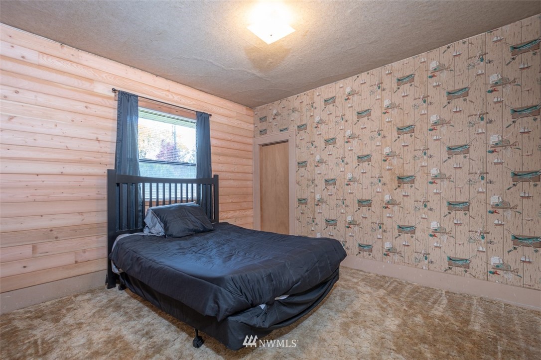 1311 Koontz Road Chehalis, WA 98532 - Photo 13 of 16 a bedroom with a bed and a wall painting