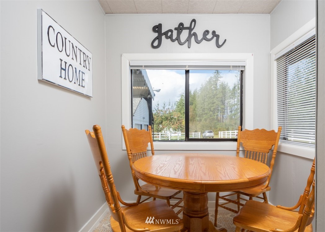 1311 Koontz Road Chehalis, WA 98532 - Photo 15 of 16 a view of a dining room with furniture window and outside view
