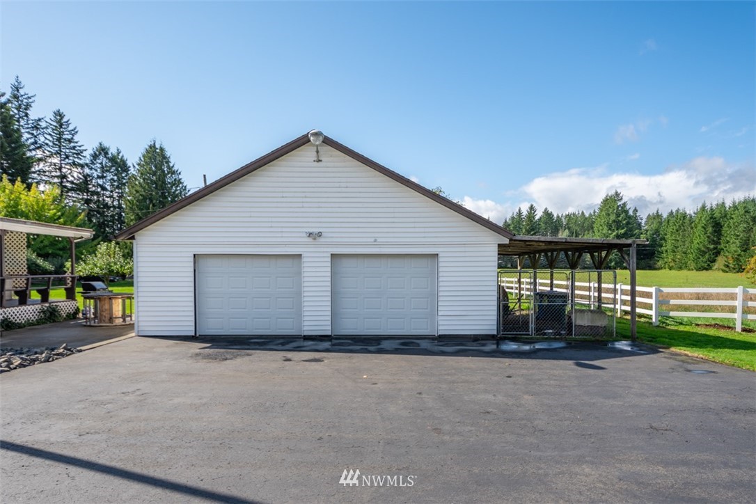 1311 Koontz Road Chehalis, WA 98532 - Photo 4 of 16 a front view of a house with a yard