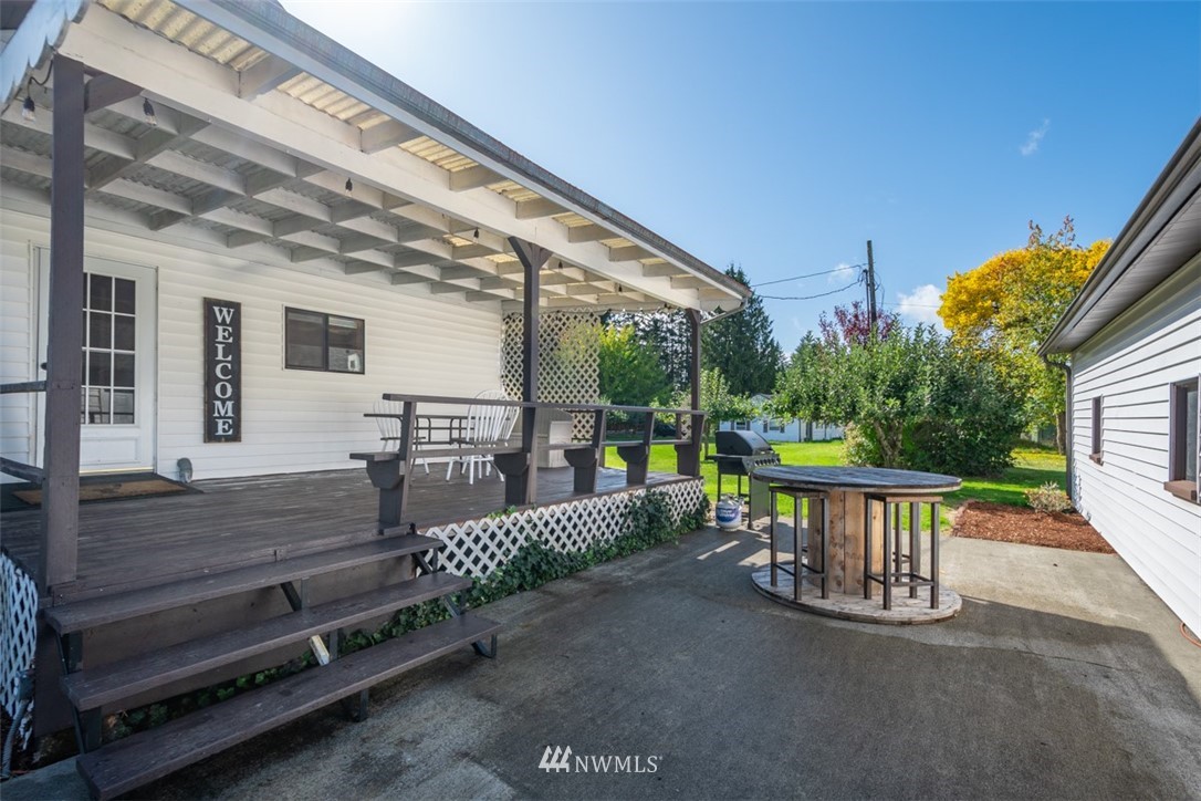 1311 Koontz Road Chehalis, WA 98532 - Photo 6 of 16 a view of a patio with table and chairs potted plants with wooden floor