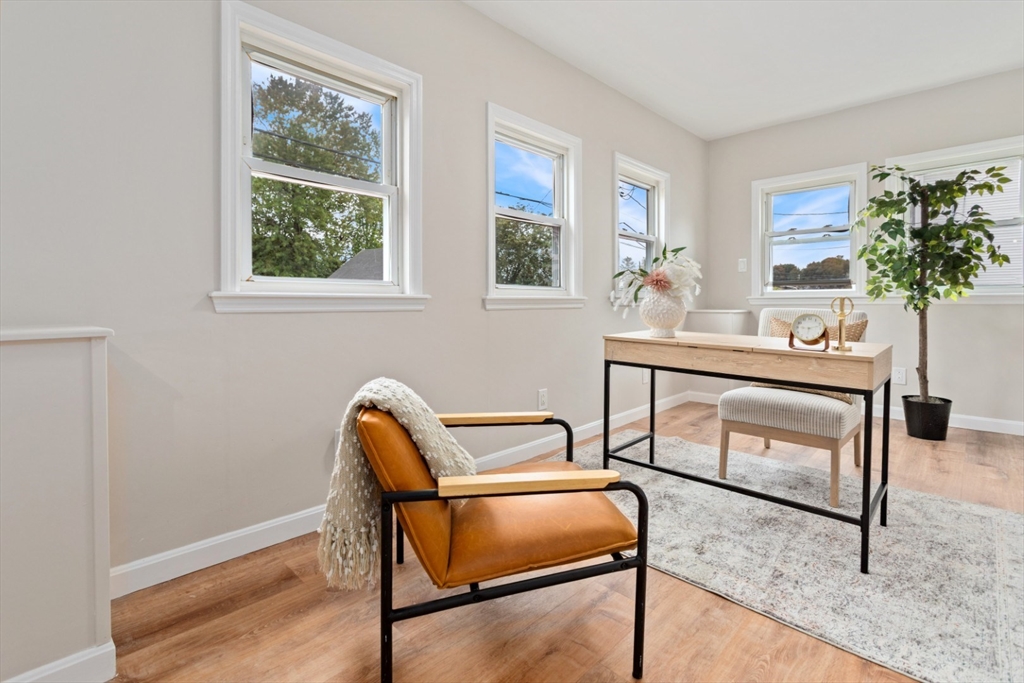 50 Shawmut Street Lawrence, MA 01841 - Photo 17 of 38 a workspace with wooden floor and a window