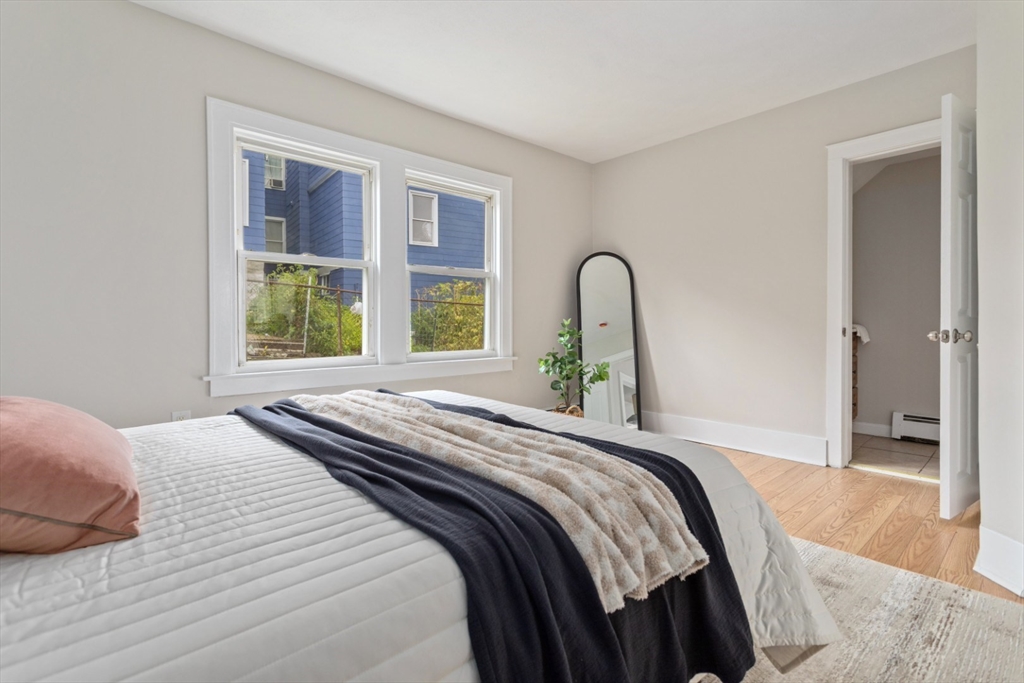 50 Shawmut Street Lawrence, MA 01841 - Photo 21 of 38 a bedroom with a bed and a large window