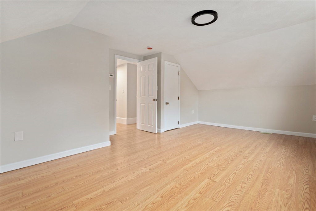 50 Shawmut Street Lawrence, MA 01841 - Photo 25 of 38 a view of empty room with wooden floor