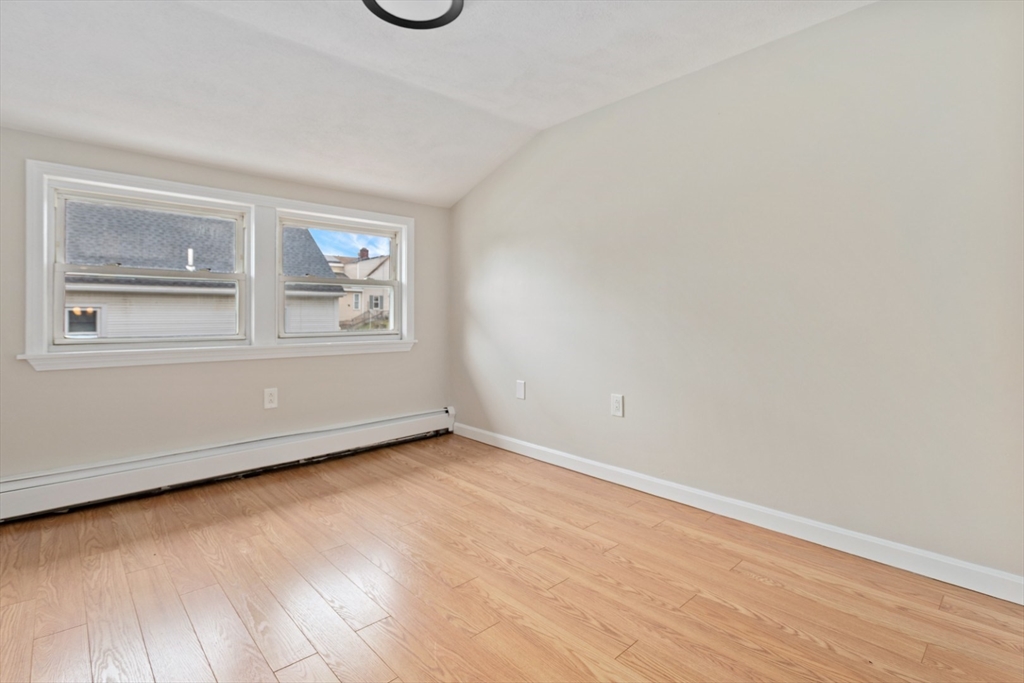 50 Shawmut Street Lawrence, MA 01841 - Photo 26 of 38 wooden floor in an empty room with a window