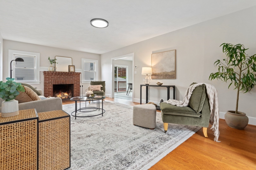 50 Shawmut Street Lawrence, MA 01841 - Photo 3 of 38 a living room with furniture and a fireplace