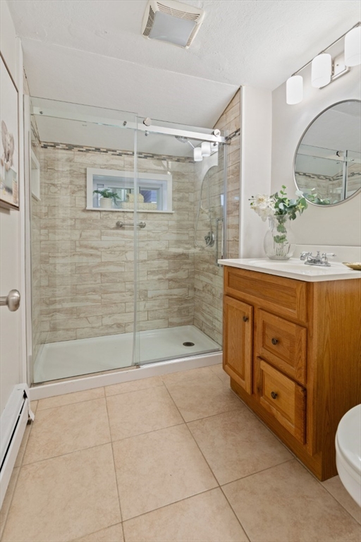 50 Shawmut Street Lawrence, MA 01841 - Photo 31 of 38 a bathroom with a granite countertop sink a toilet and shower