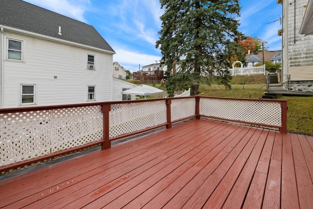 50 Shawmut Street Lawrence, MA 01841 - Photo 33 of 38 a view of balcony with wooden floor and fence