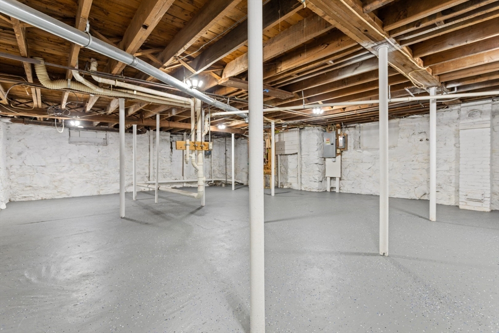 50 Shawmut Street Lawrence, MA 01841 - Photo 38 of 38 a view of an empty room with wooden walls