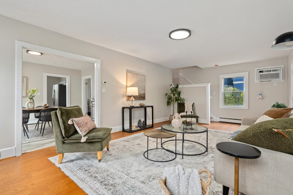 50 Shawmut Street Lawrence, MA 01841 - Photo 7 of 38 a living room with furniture and a table