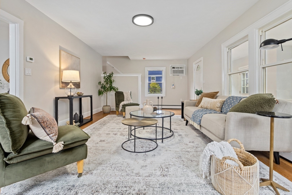 50 Shawmut Street Lawrence, MA 01841 - Photo 8 of 38 a living room with furniture a rug and a window