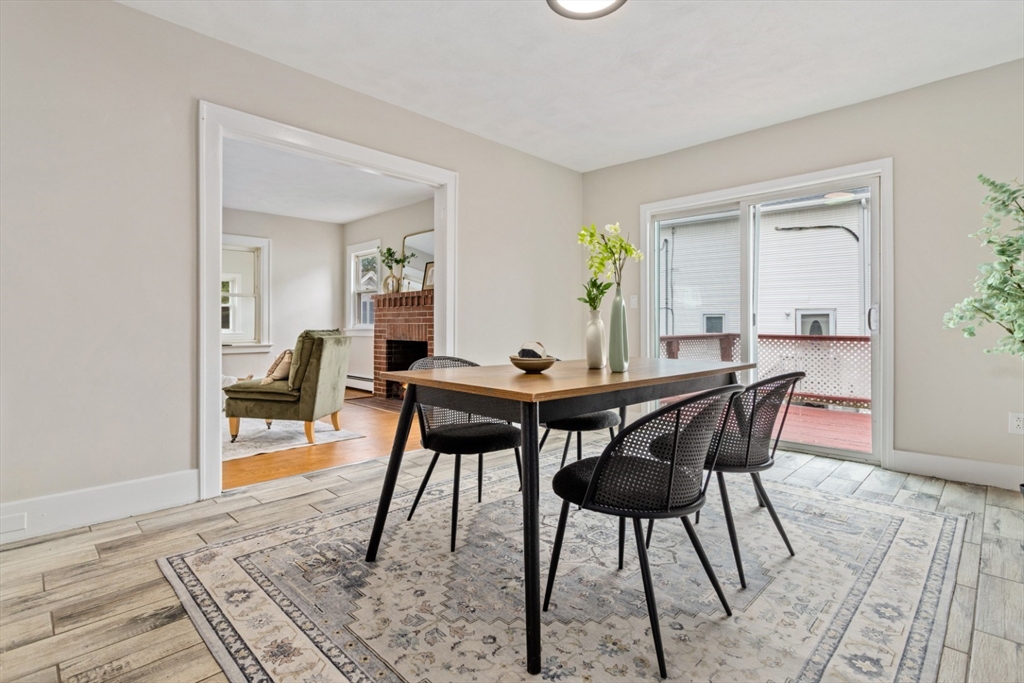 50 Shawmut Street Lawrence, MA 01841 - Photo 9 of 38 a dining room with furniture and wooden floor