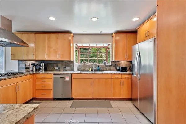 a kitchen with a sink and bathtub