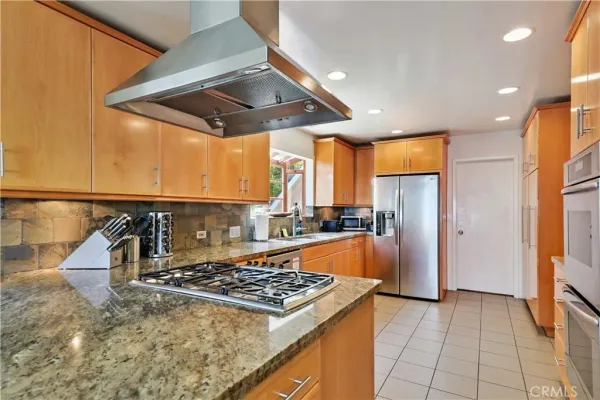 a bed room with furniture and a flat screen tv