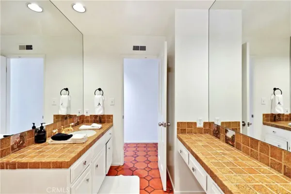 a bedroom with a bed and a television