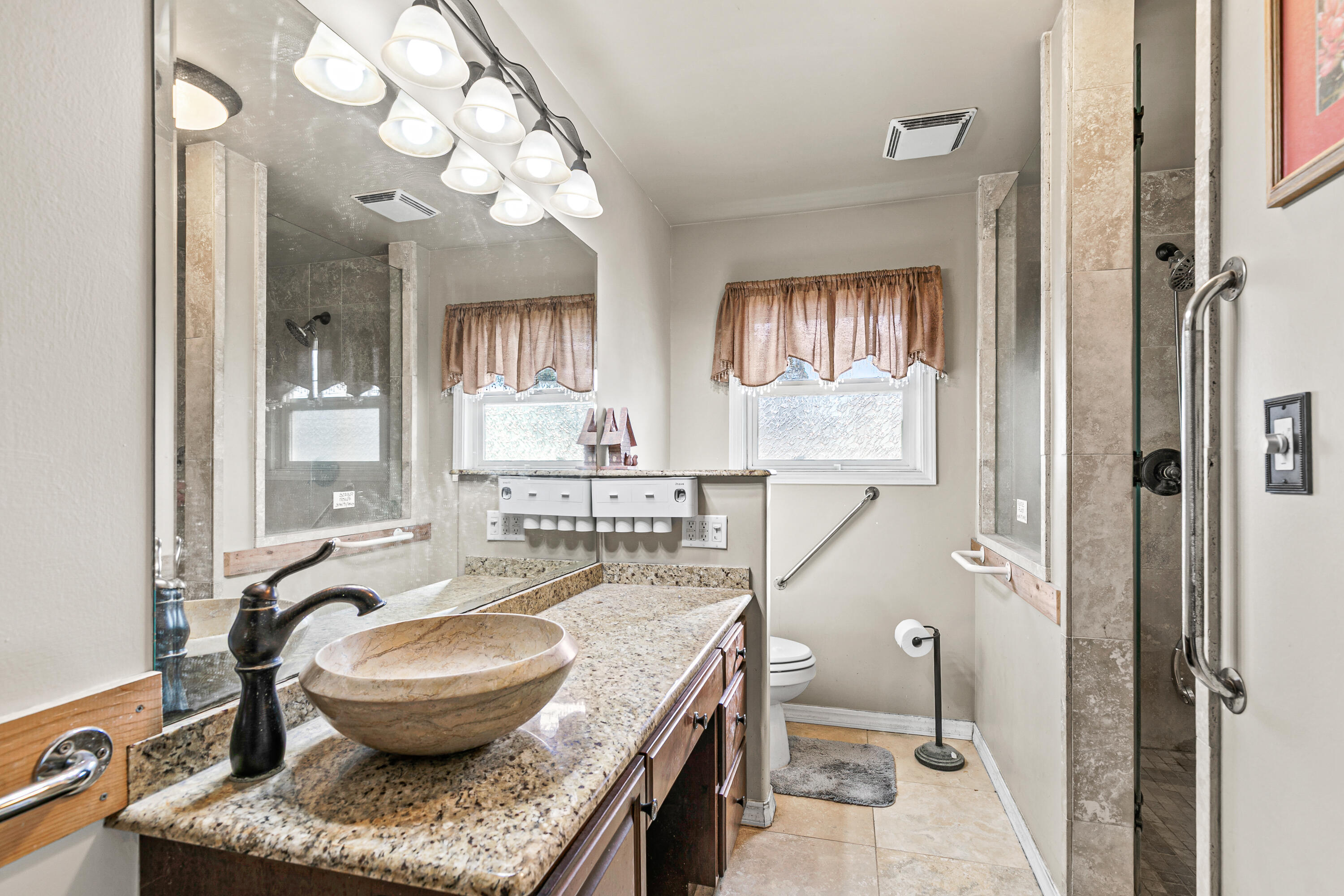 3200 Hanley Road Central Point, OR 97502 - Photo 15 of 25 a bathroom with a granite countertop sink a mirror and a bathtub