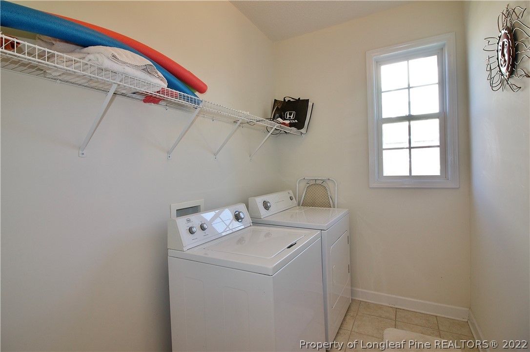 215 Kelly Road Pinehurst, NC 28374 - Photo 11 of 27 a utility room with dryer and washer