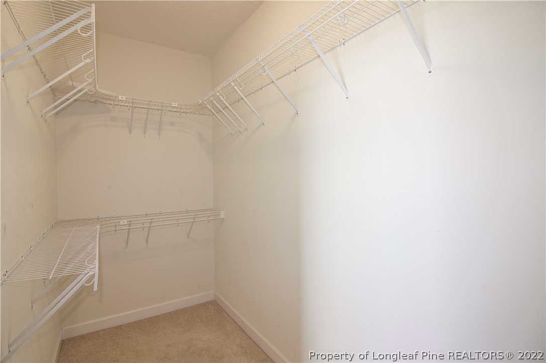 215 Kelly Road Pinehurst, NC 28374 - Photo 16 of 27 a view of a room with racks on the wall