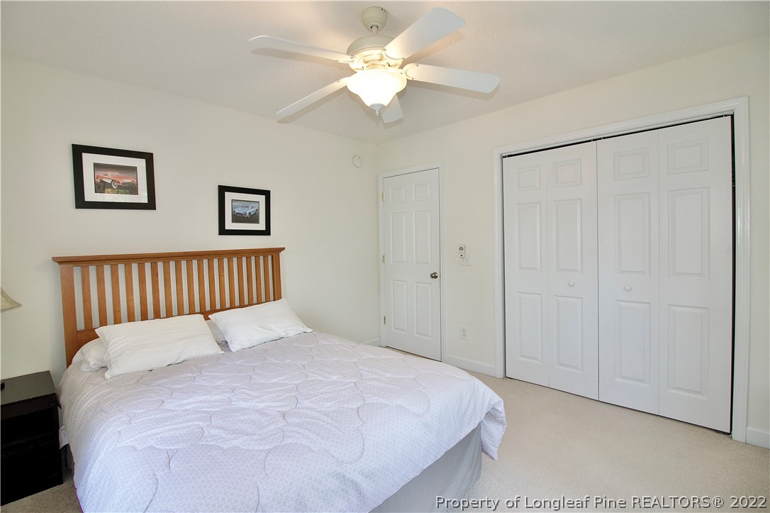 215 Kelly Road Pinehurst, NC 28374 - Photo 21 of 27 a large white bed in a white room