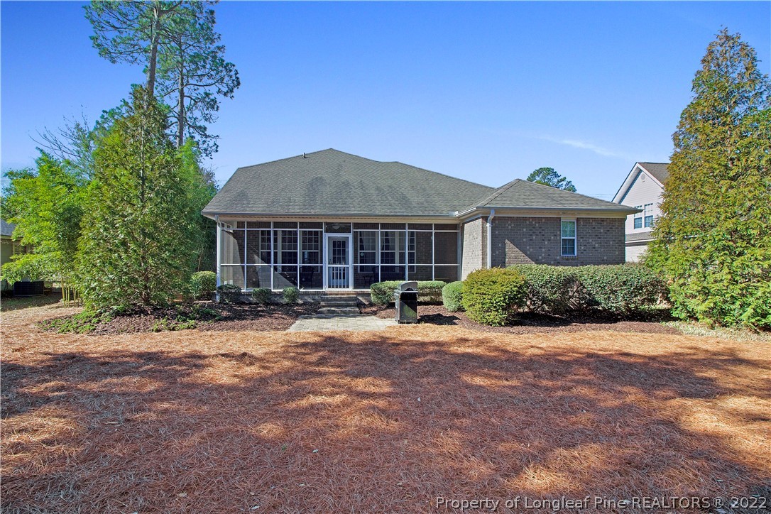 215 Kelly Road Pinehurst, NC 28374 - Photo 26 of 27 a front view of a house with a garden