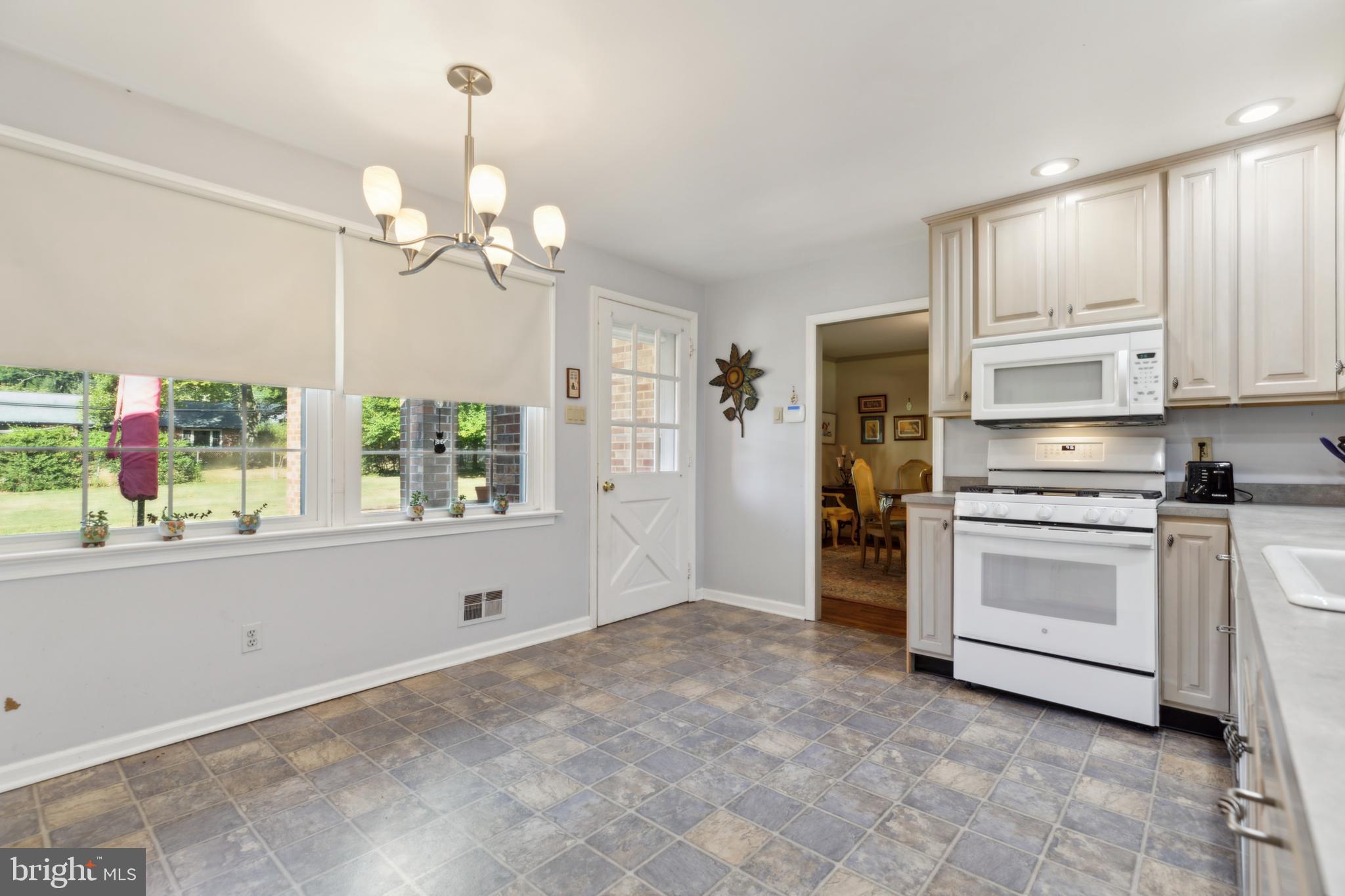 824 Juniper Drive Lafayette Hill, PA 19444 - Photo 15 of 28 Door to Covered Porch from Kitchen