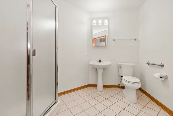 a bathroom with a toilet and a sink