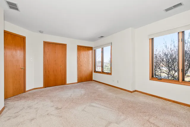 a view of an empty room with windows