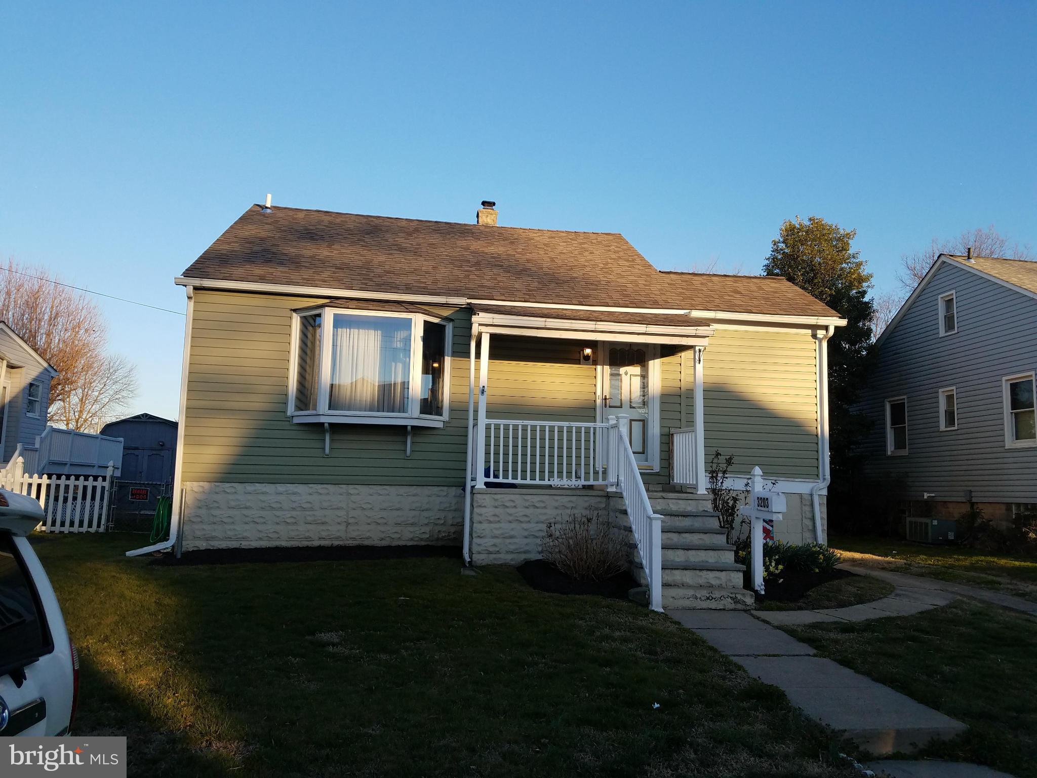3203 River Drive Road Baltimore, MD 21219 - Photo 1 of 18 a front view of a house with garden