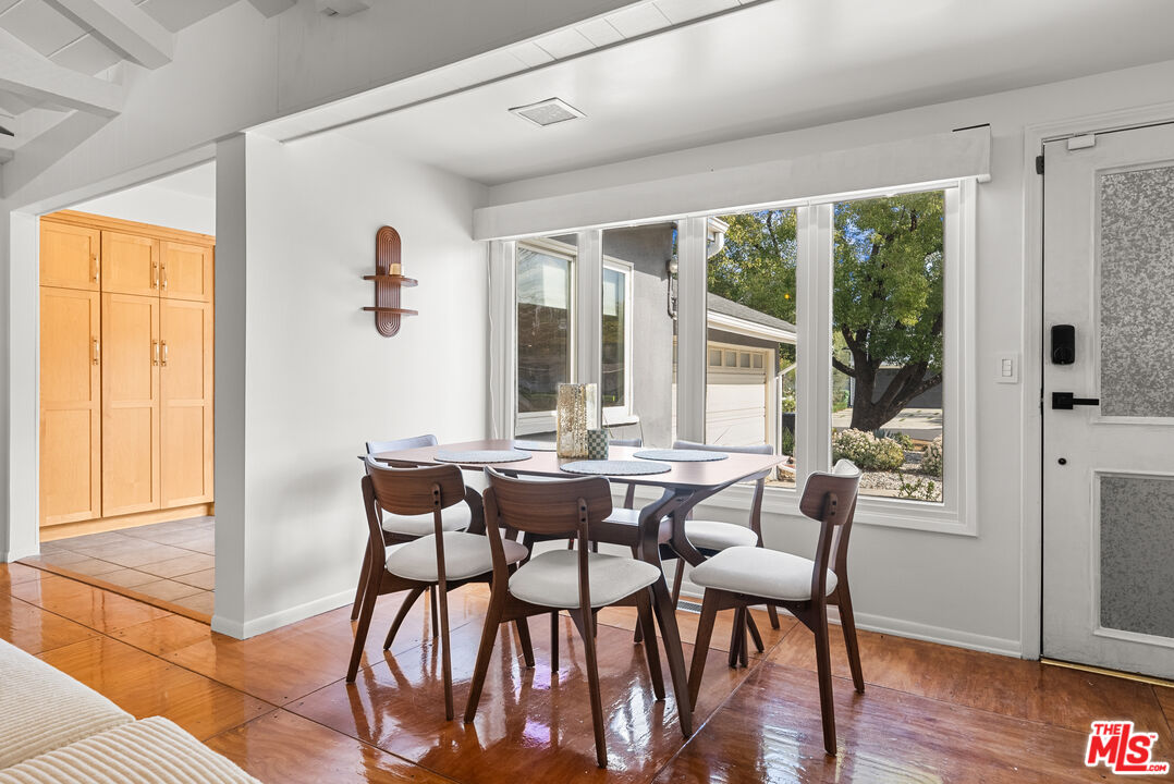5127 Gaynor Avenue Encino, CA 91436 - Photo 12 of 29 a view of a dining room with furniture window and wooden floor