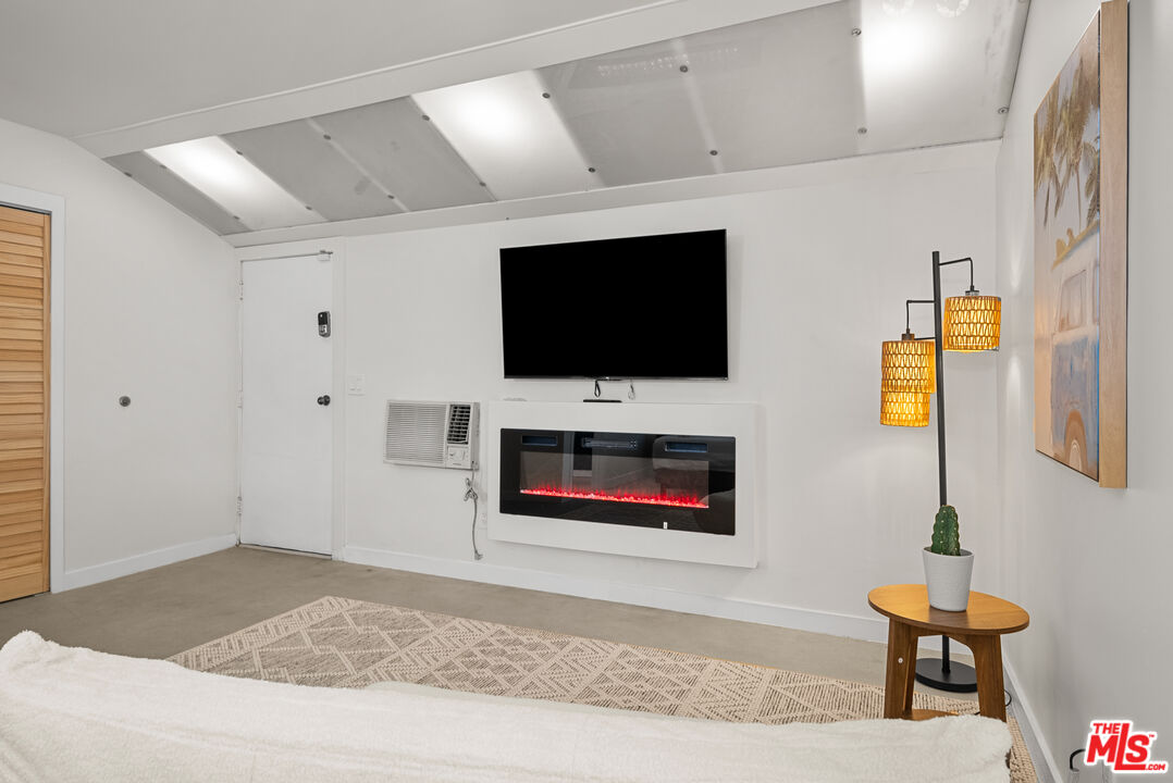 5127 Gaynor Avenue Encino, CA 91436 - Photo 14 of 29 a living room with furniture and a flat screen tv