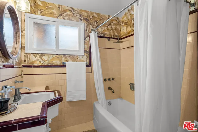 a bathroom with a bathtub and a sink