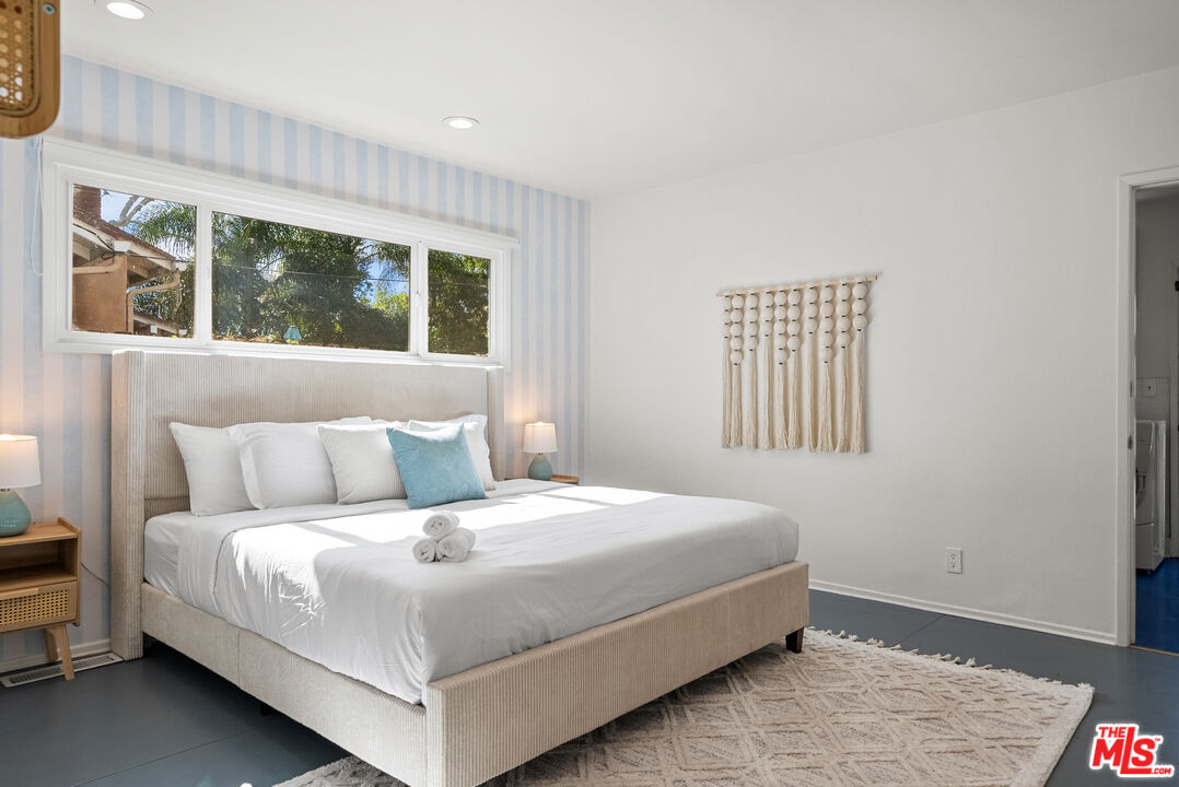 5127 Gaynor Avenue Encino, CA 91436 - Photo 21 of 29 a bedroom with a bed and window