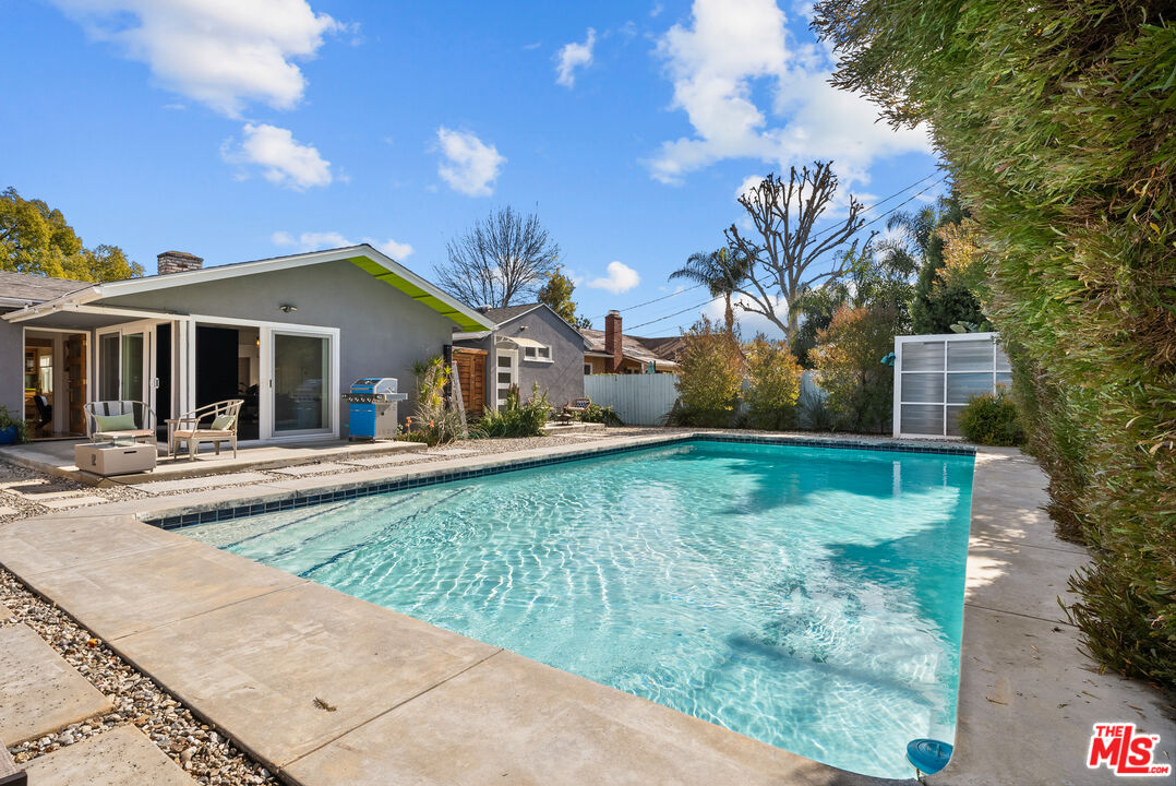 5127 Gaynor Avenue Encino, CA 91436 - Photo 27 of 29 front view of a house with a yard