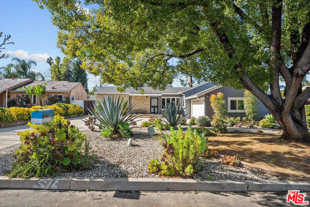 5127 Gaynor Avenue Encino, CA 91436 - Photo 29 of 29 a front view of a house with garden