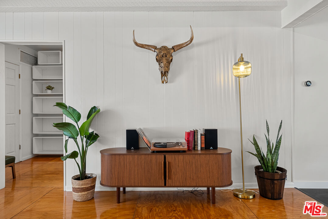 5127 Gaynor Avenue Encino, CA 91436 - Photo 6 of 29 a living room with furniture and a potted plant