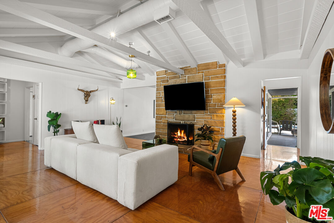5127 Gaynor Avenue Encino, CA 91436 - Photo 7 of 29 a living room with furniture and a flat screen tv