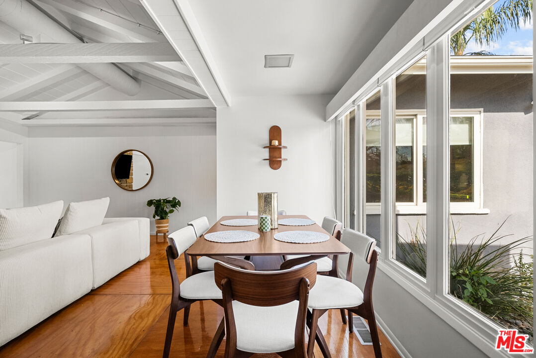5127 Gaynor Avenue Encino, CA 91436 - Photo 8 of 29 a view of a dining room with furniture window and wooden floor
